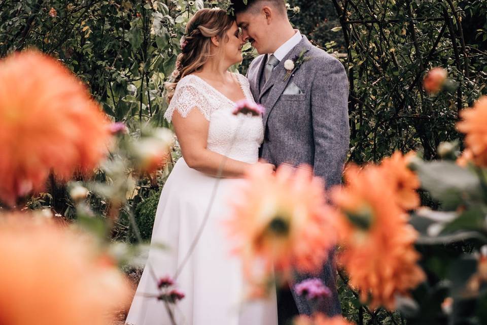 Bride and groom with dahlias