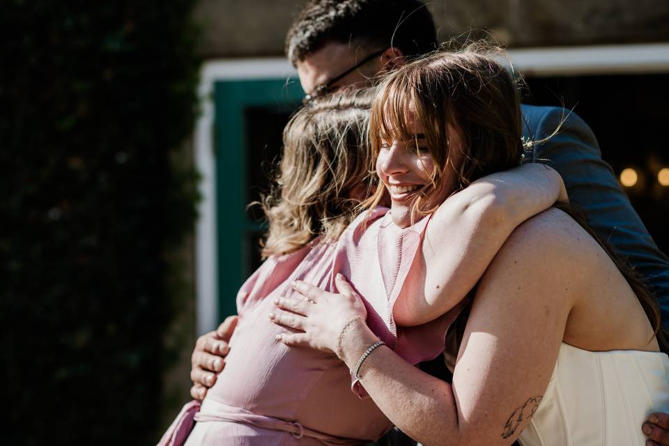 Hugging the couple