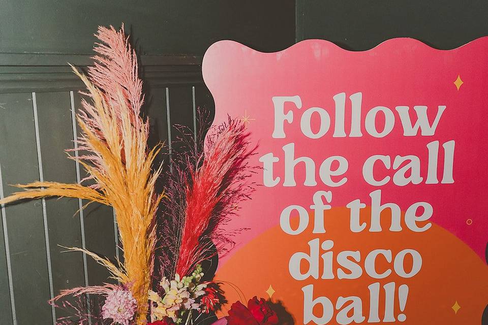 Pink and orange welcome sign