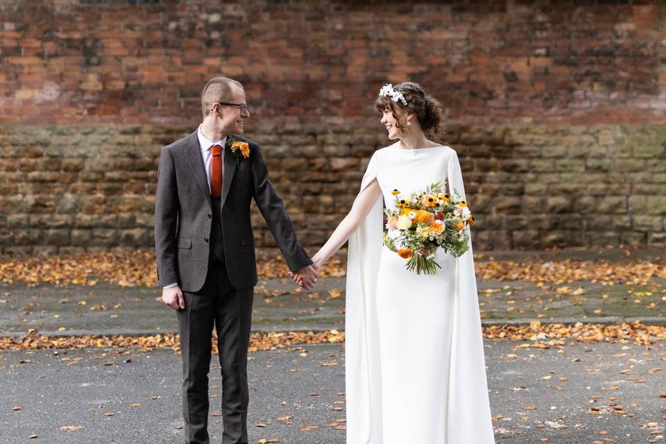 Autumnal wedding - holding hands