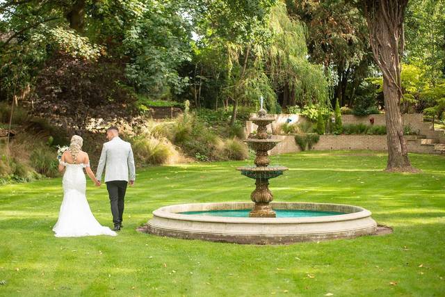 Hand in hand by fountain