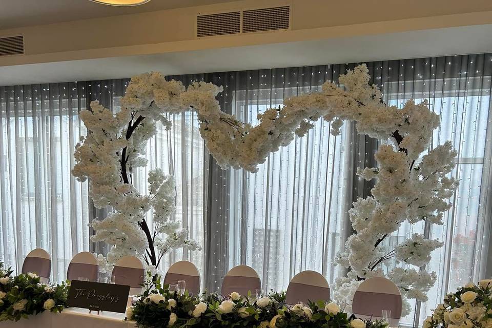 Blossom heart arch behind top