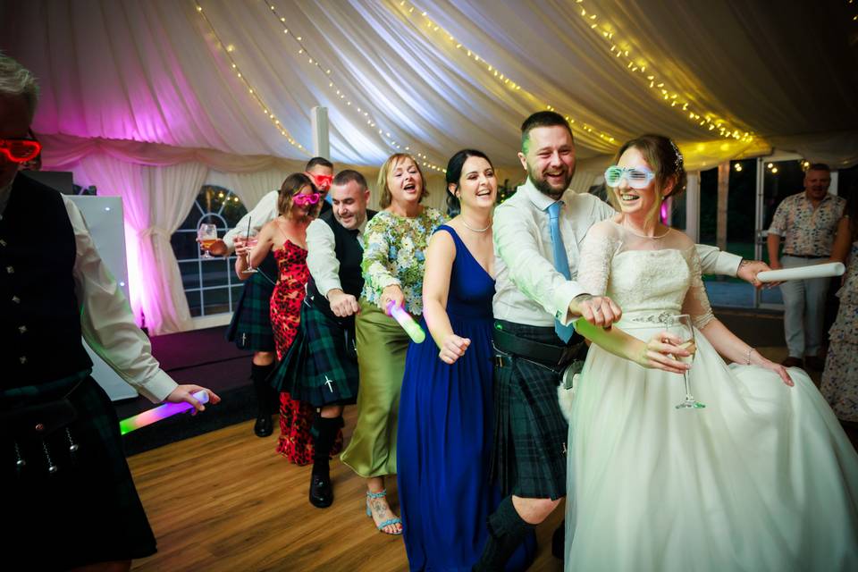 Conga line on dance floor