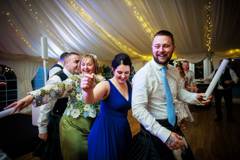 Wedding guests dancing
