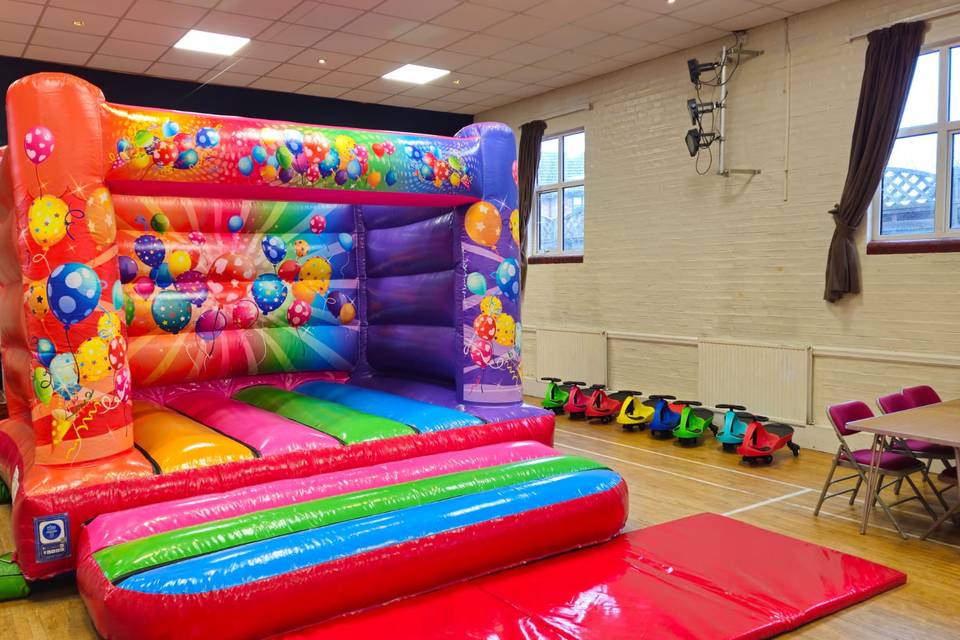 Red low height bouncy with car