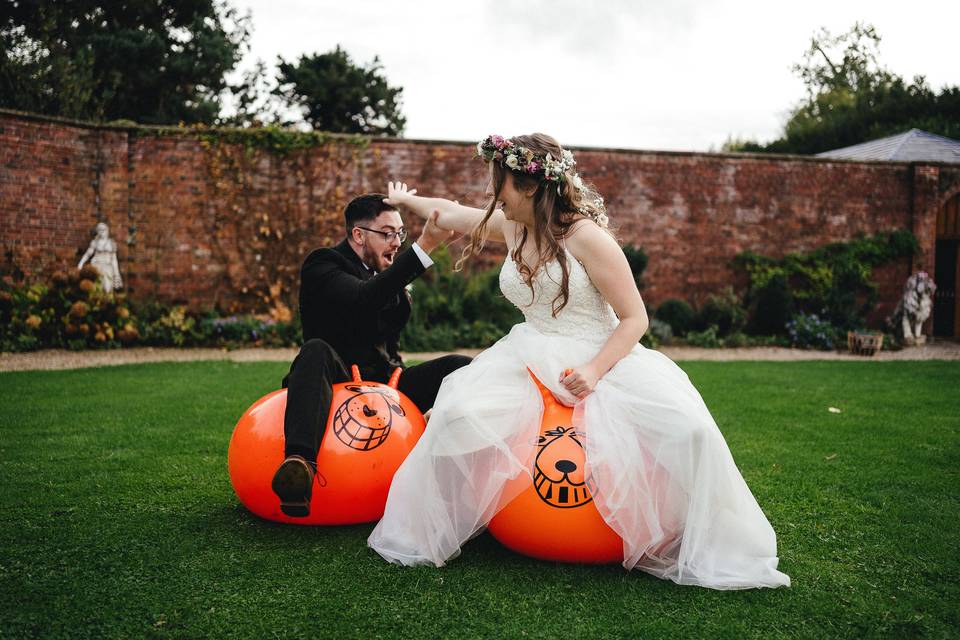 Couple on space hoppers