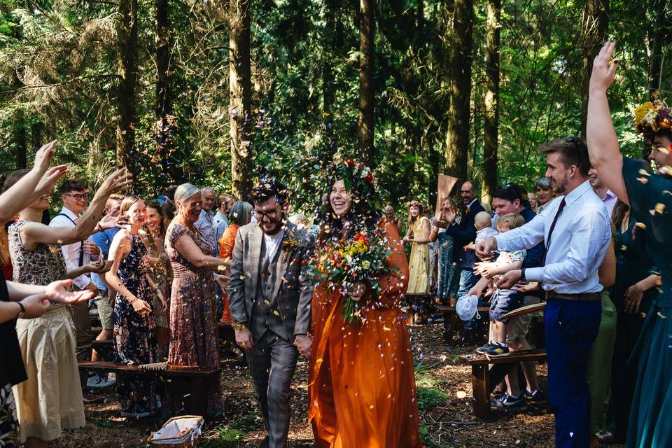 Couple walking down aisle