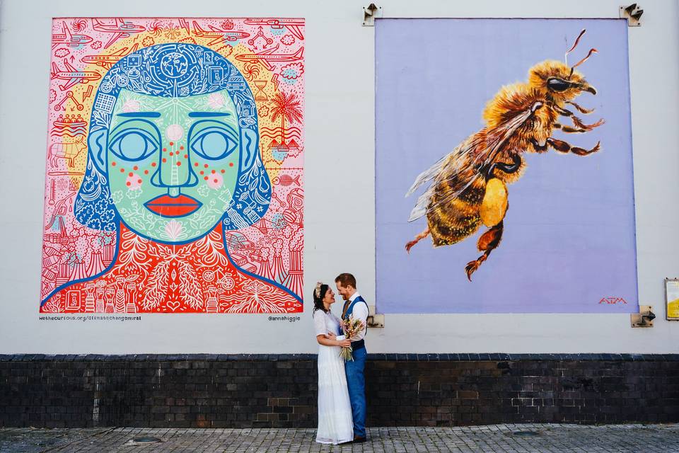 Couple in front of art in bris