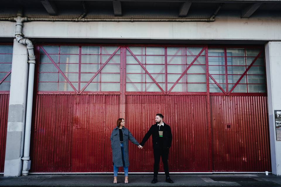 Couple in front of m shed