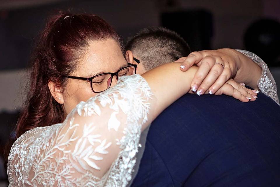 Bride and groom hugging