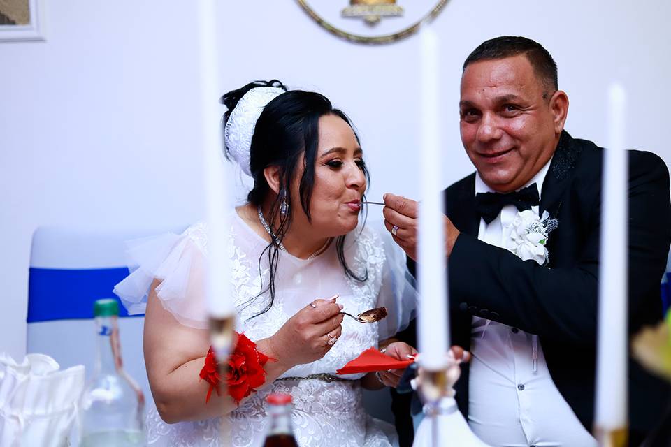 Bride and groom eating cake