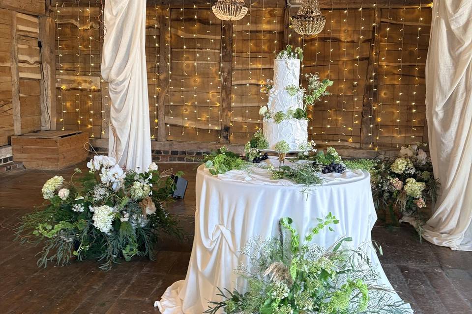 Drapery arch and cake table