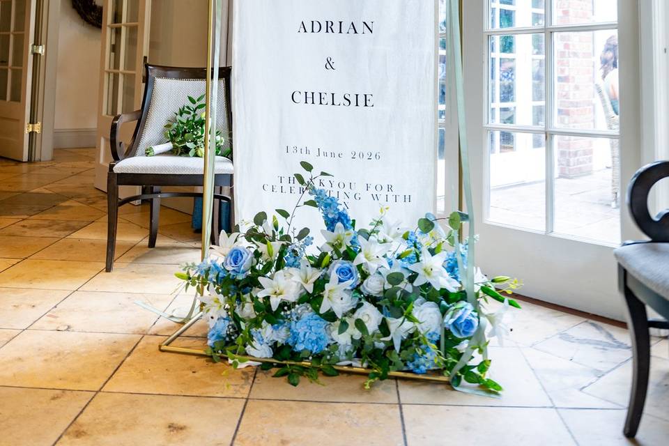 Entrance welcome sign with flowers