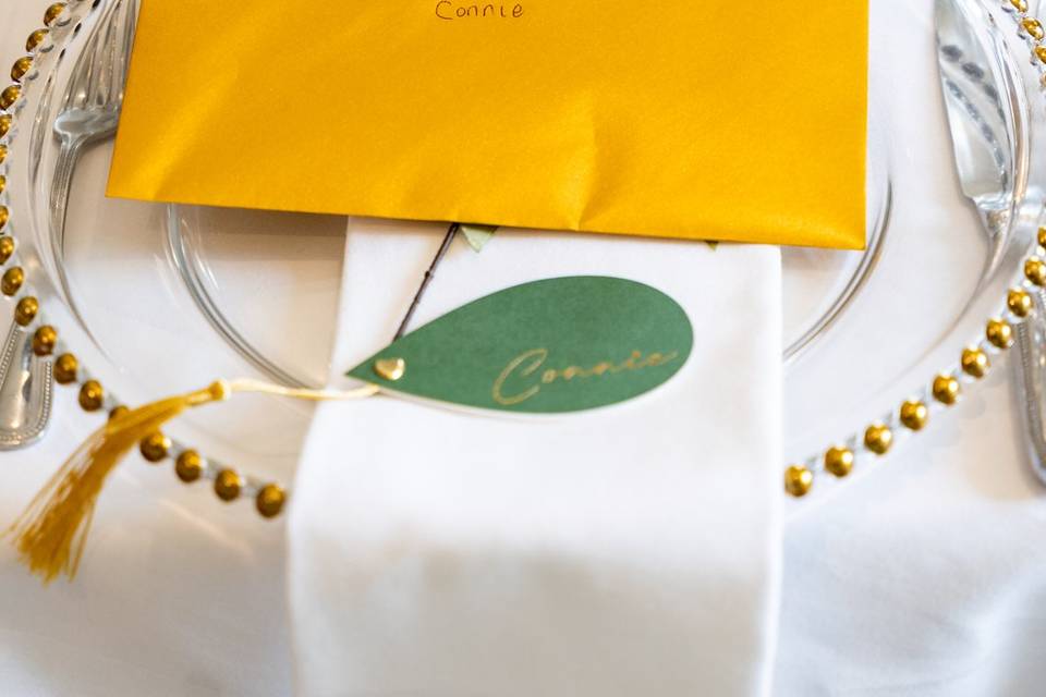 Place setting with bright yellow napkin