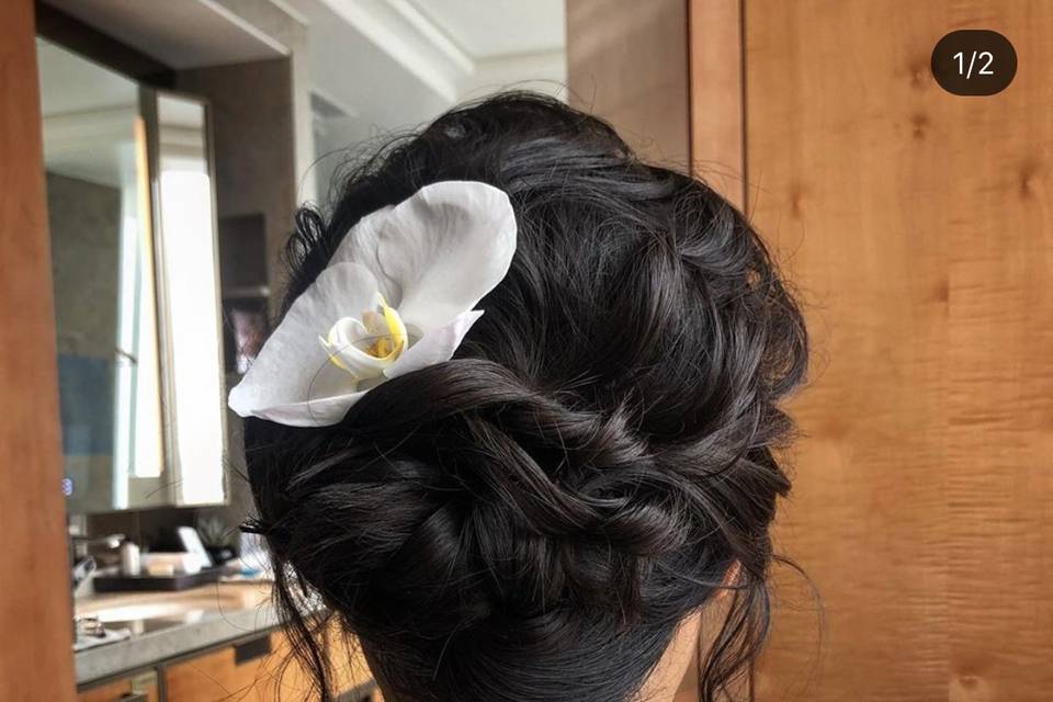Wedding updo with flower