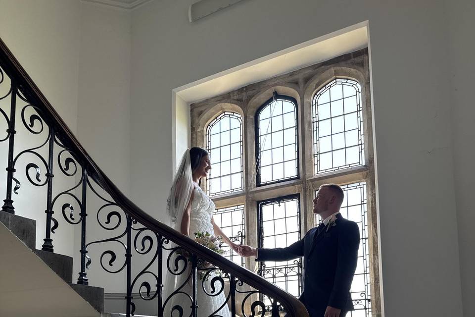 A couple posing on the stairs
