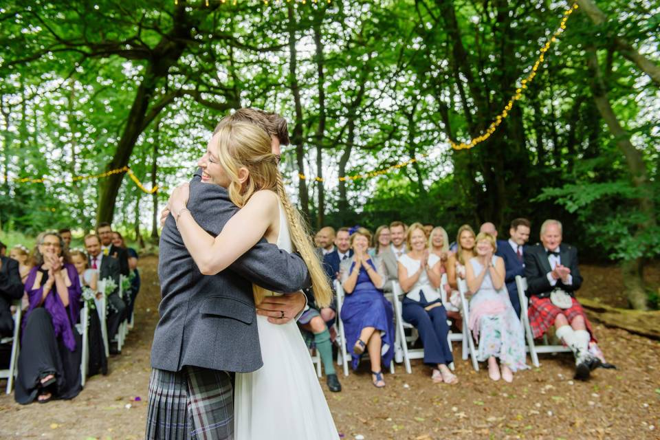 Woodland wedding hug