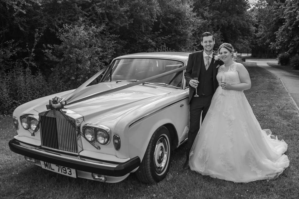 Bride & Groom with car