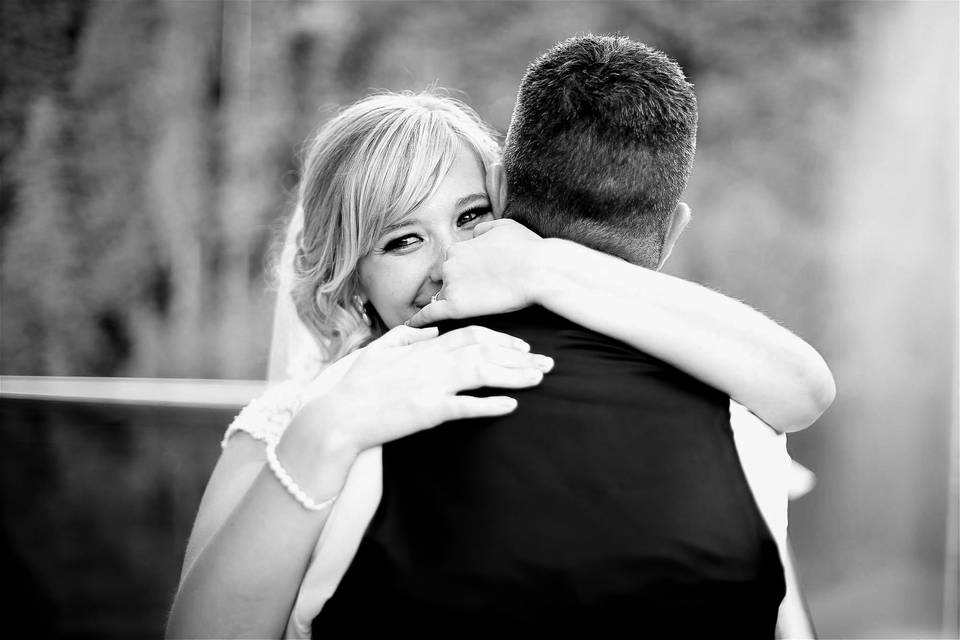 A bride embracing her groom