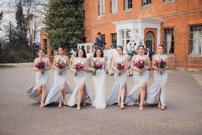 Bride and bridesmaids in front of the Manor House