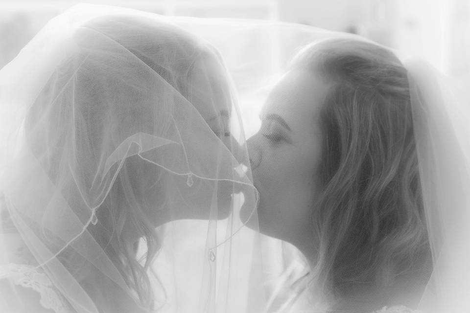 Brides Veiled Kiss