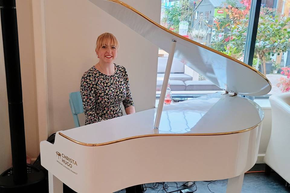 White baby grand piano