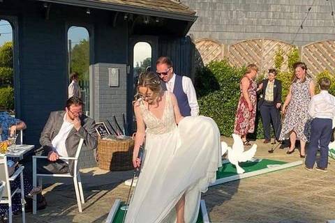Bride playing crazy golf