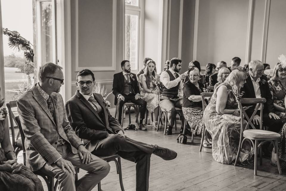 Groom waiting with guests.