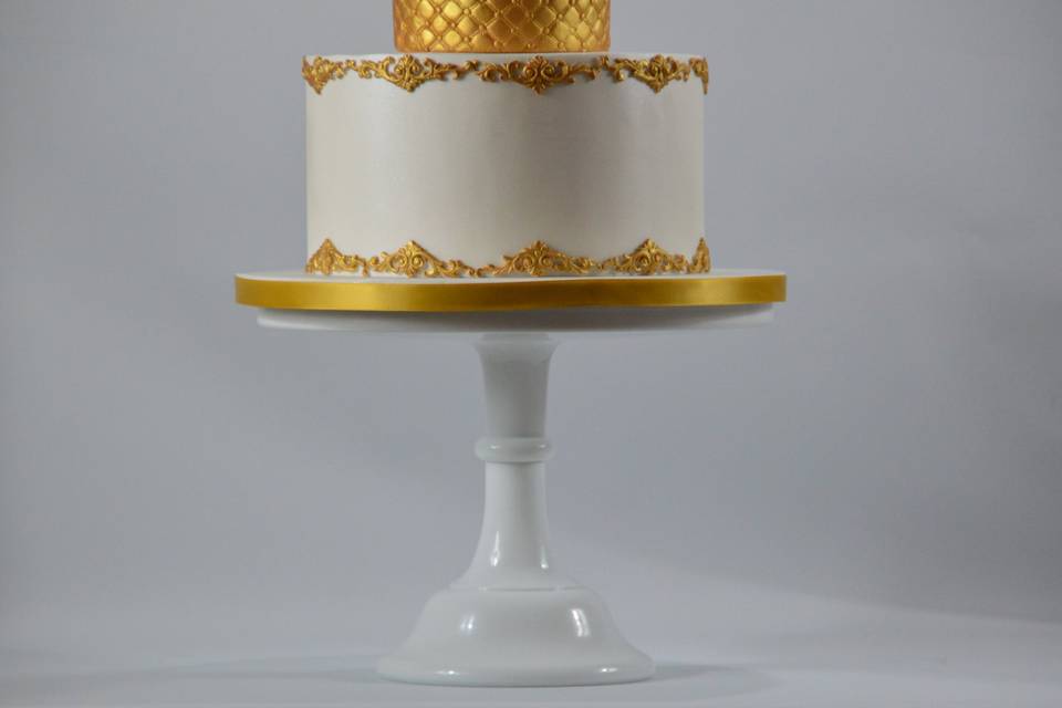 Gold and white decorated cake