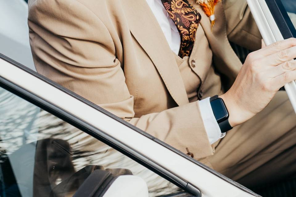 Groom with the wedding car