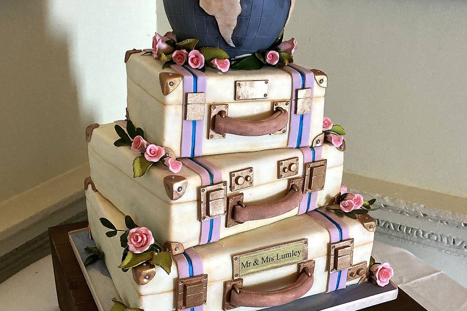 Suitcase globe wedding cake