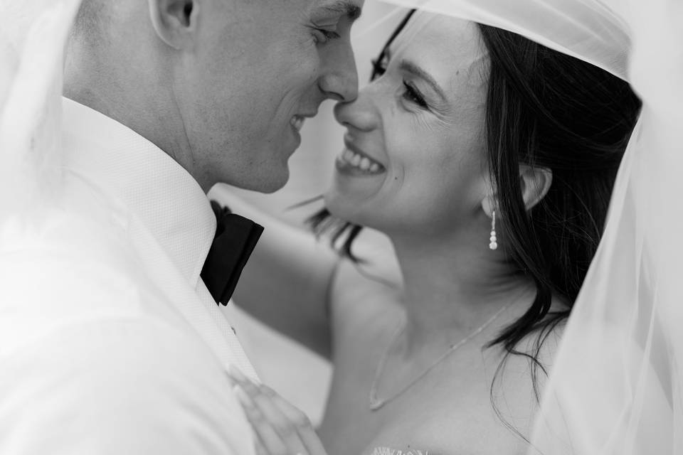 Bride and Groom under veil
