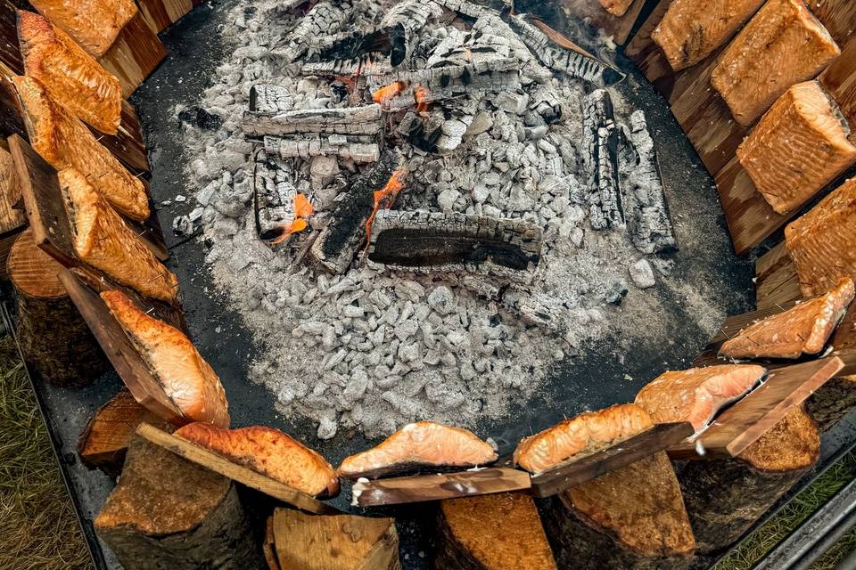 Salmon cooking on the fire pit