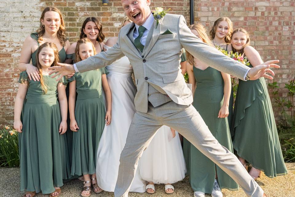 Groom jumping into photo