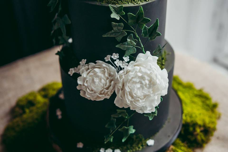 Black woodland wedding cake