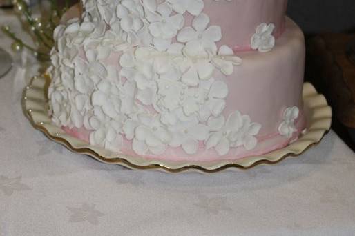 Pink cake with white blossom