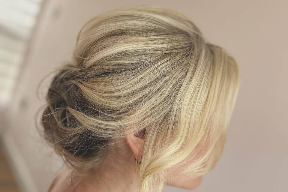 Soft textured low bun