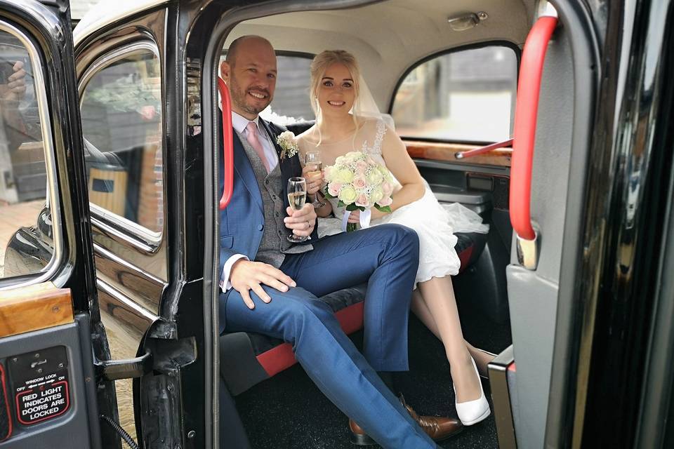 Bride & Groom in Black Cab