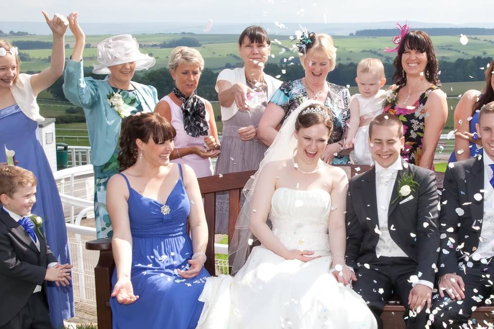 Wedding party under confetti