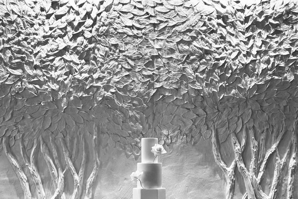 White wedding cake with leaves