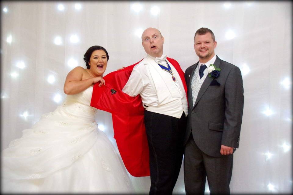Newlyweds and their toastmaster