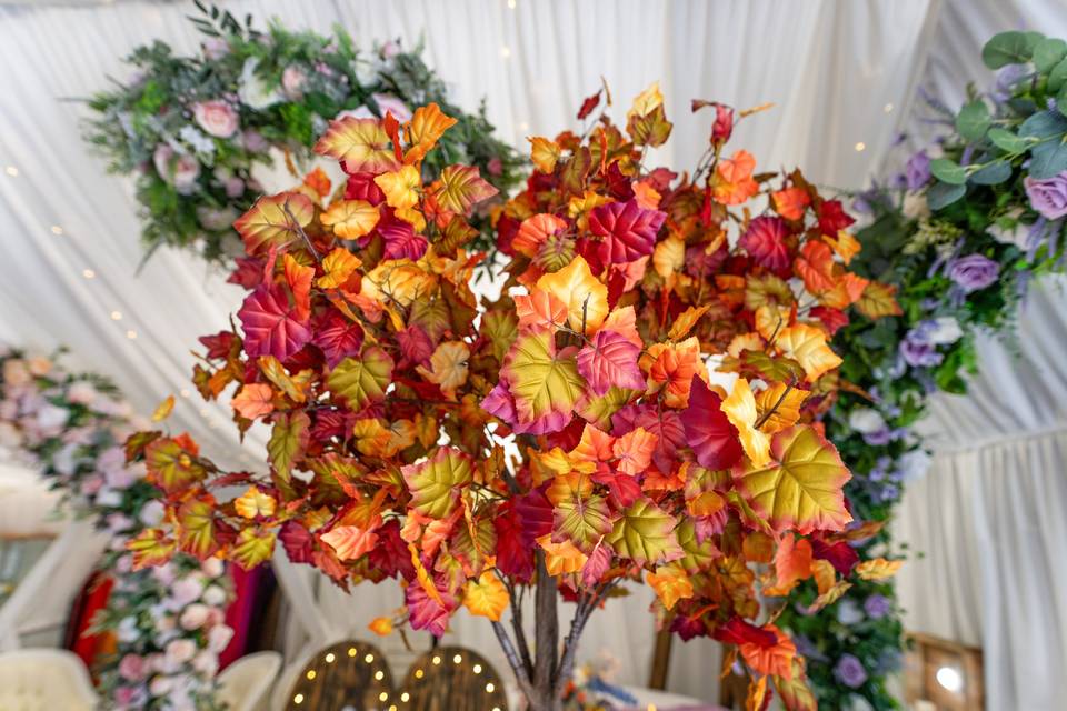 Autumnal tree centerpiece with red and orange leaves