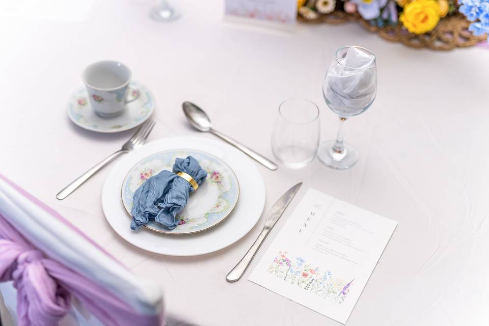 Elegant place setting with lavender napkin and menu