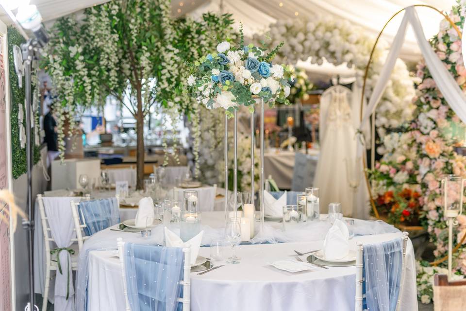 Event reception area with white and blue decor