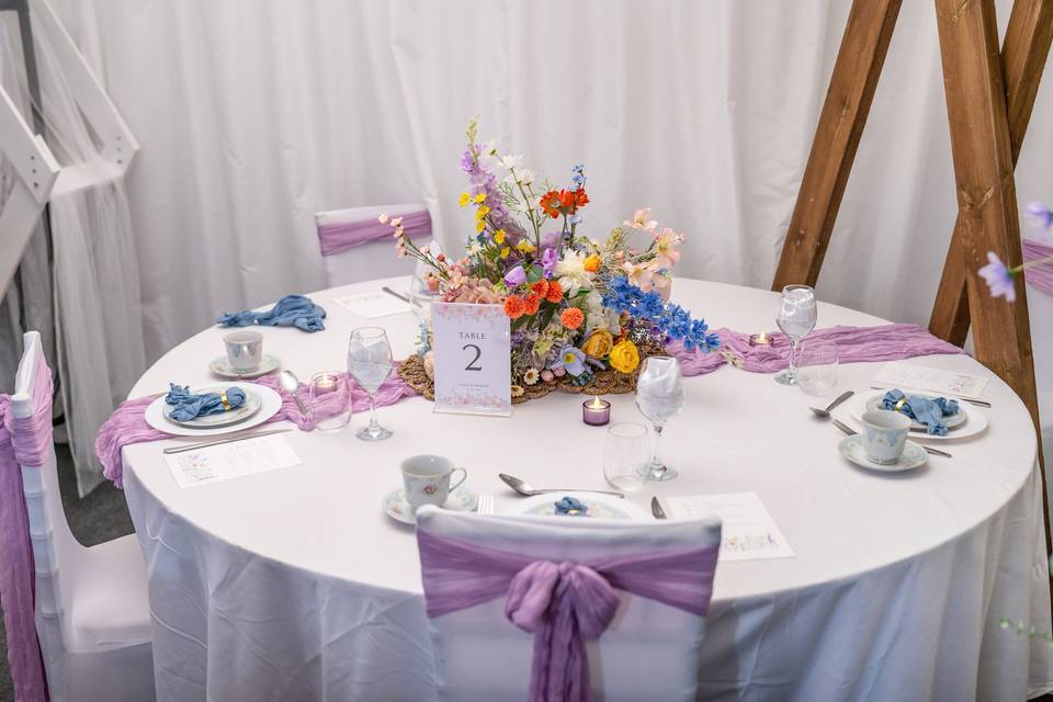 Round table set with lavender and purple accents