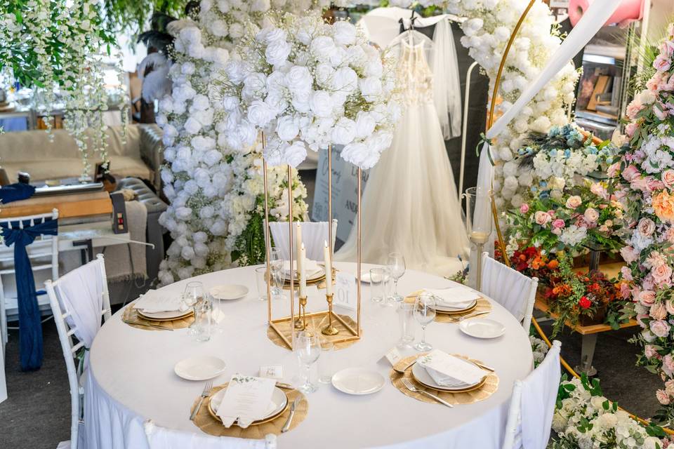 Round table with large white floral centerpiece