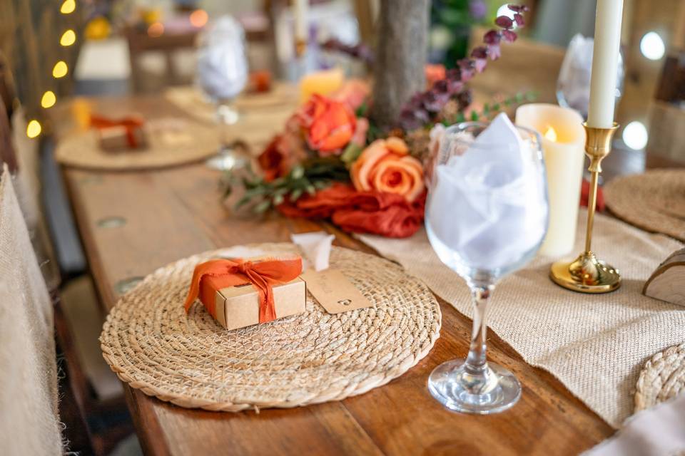 Rustic wooden table with orange autumn decor