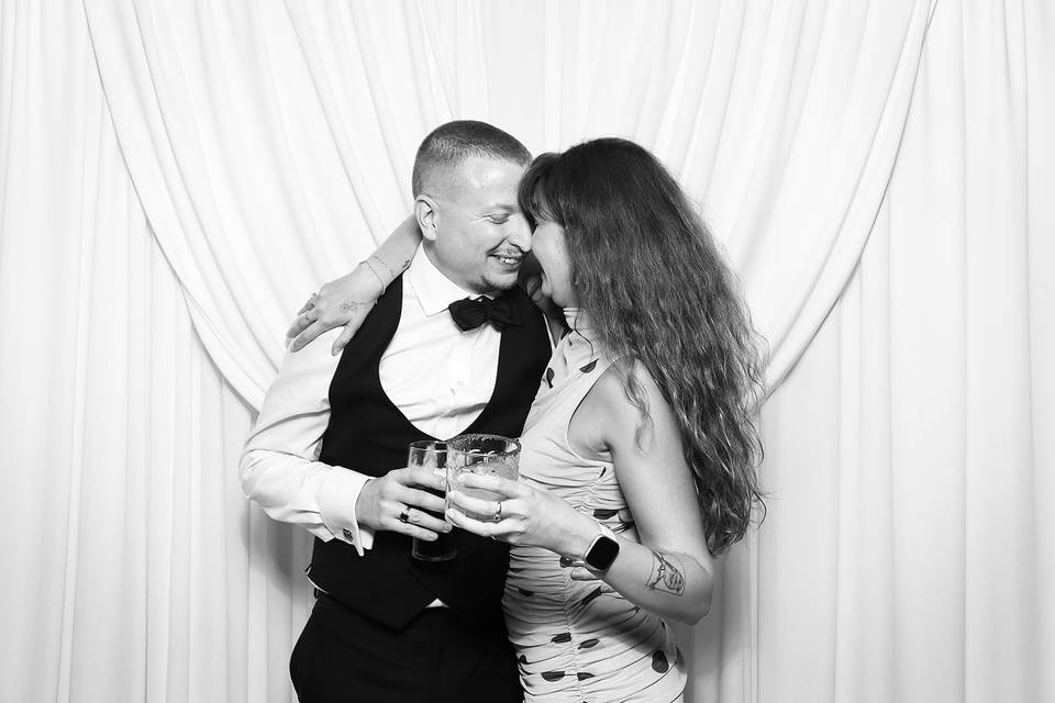 Couple against drapes backdrp