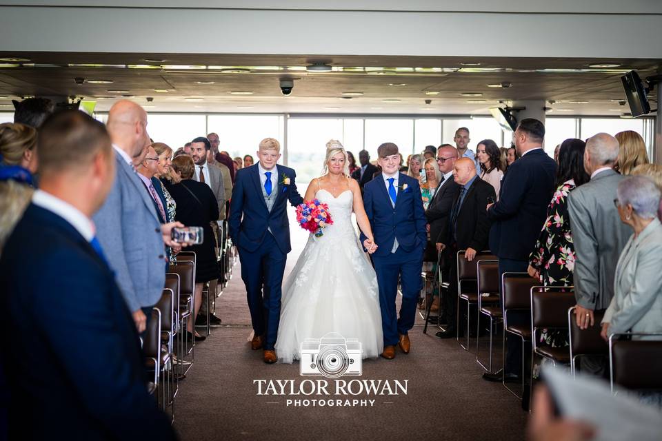 Sons walking down the aisle