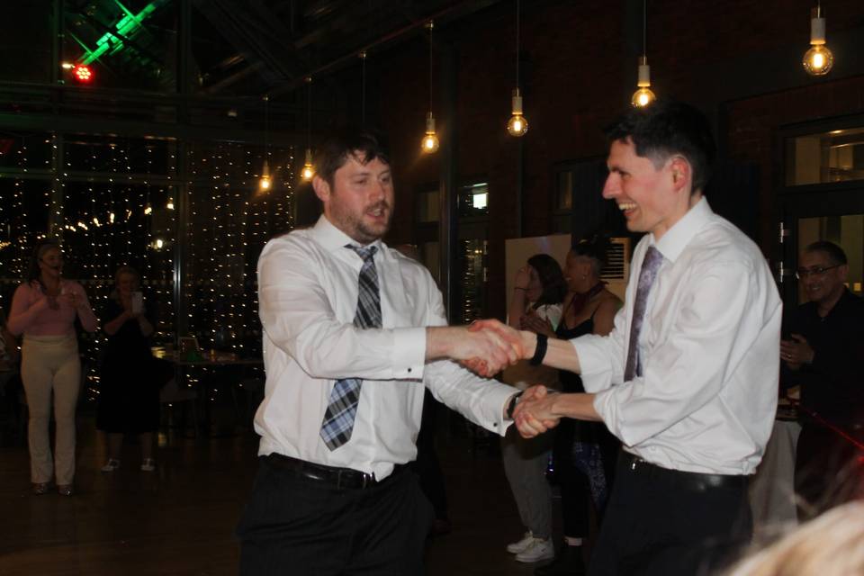 Two guests swinging each other